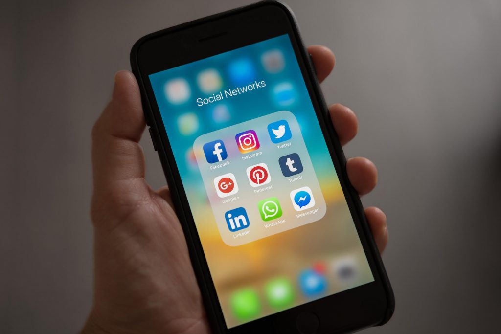 iPhone displaying popular social media icons